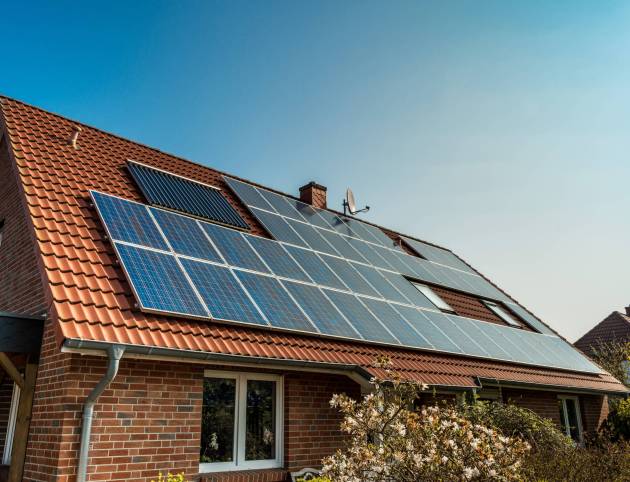 Solar panel on a red roof Solar panel on a red roof